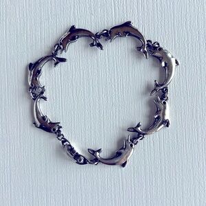 Silver Dolphins Charm Bracelet Size 7 1/4 inches in length. See pictures.